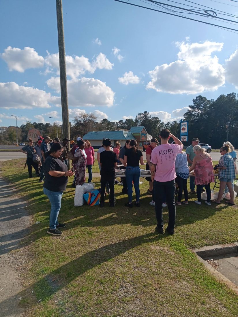 Neighbors gathering for a meal at a Moultrie Street Feed