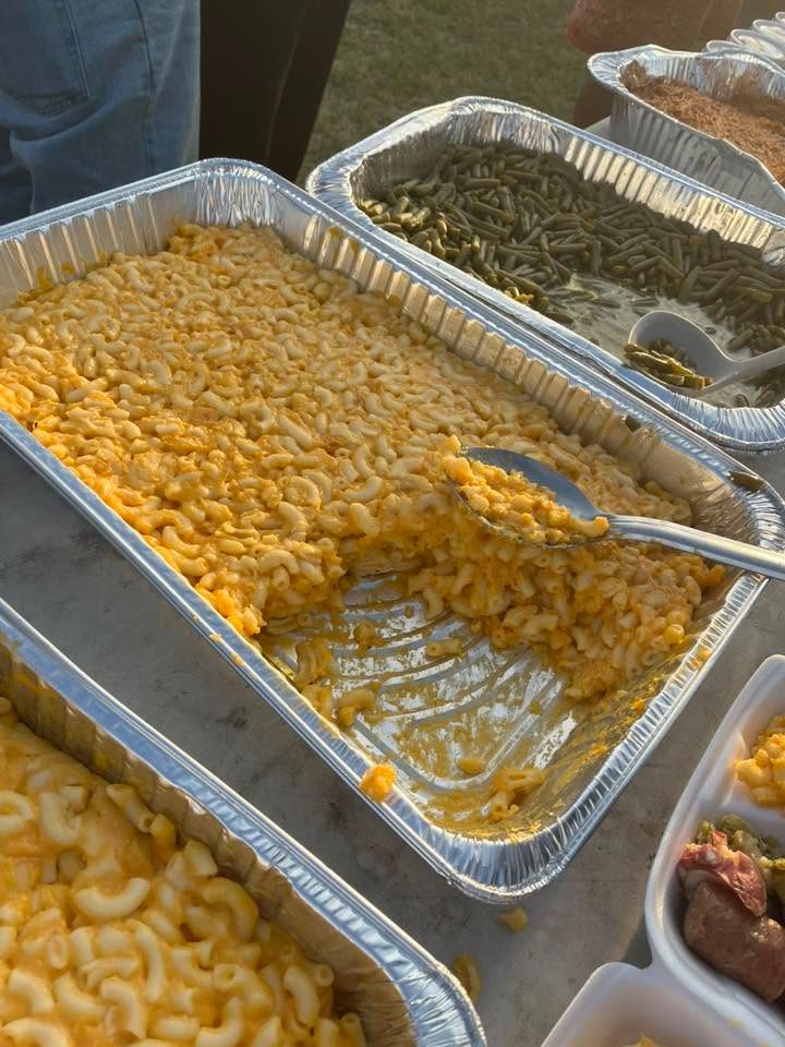 Trays of mac and cheese and green beans ready to serve